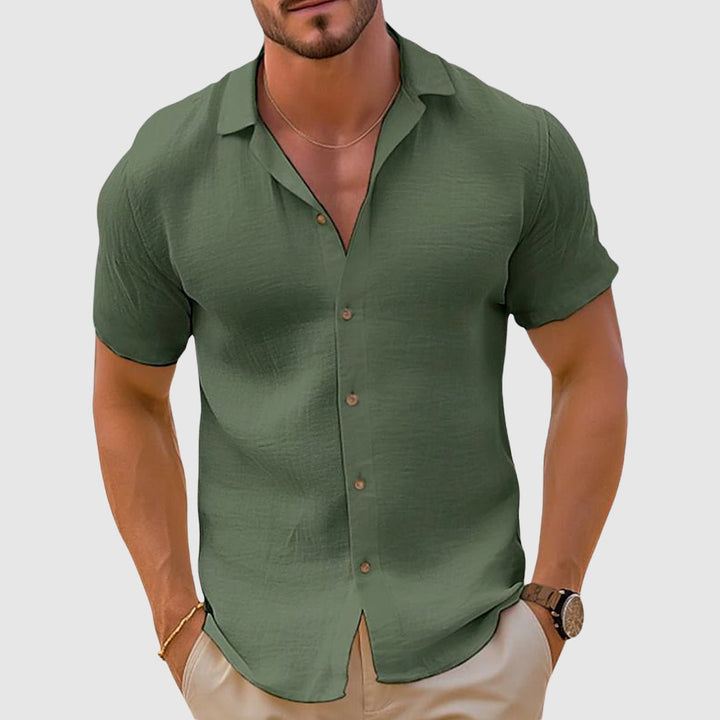 Back view of men's relaxed fit collared shirt, designed for summer comfort and effortless casual wear. Short sleeve top.