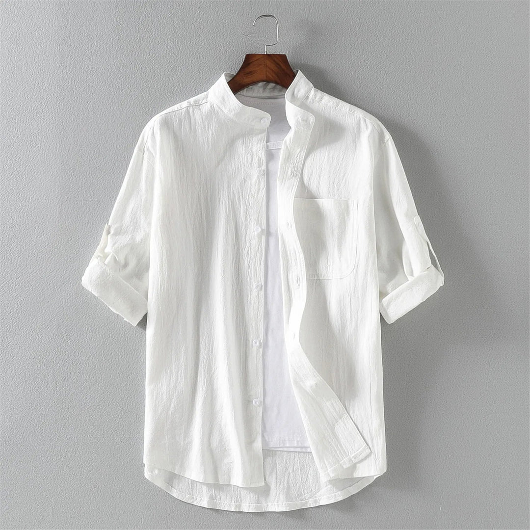 Close-up of men's relaxed fit cotton button-up shirt, showcasing the fabric and long sleeves.