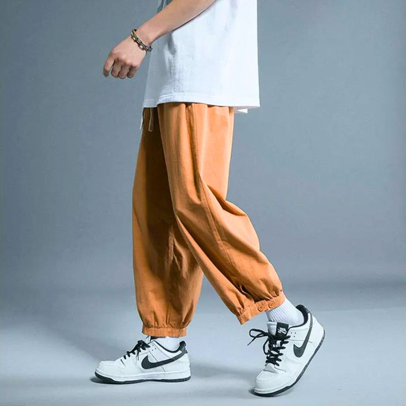 Men's relaxed fit drawstring casual pants with elastic cuffs, perfect for everyday comfort and versatile style.