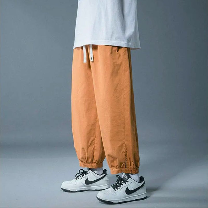 Comfortable men's drawstring pants, relaxed fit, ideal for casual wear, loungewear, or versatile everyday style.