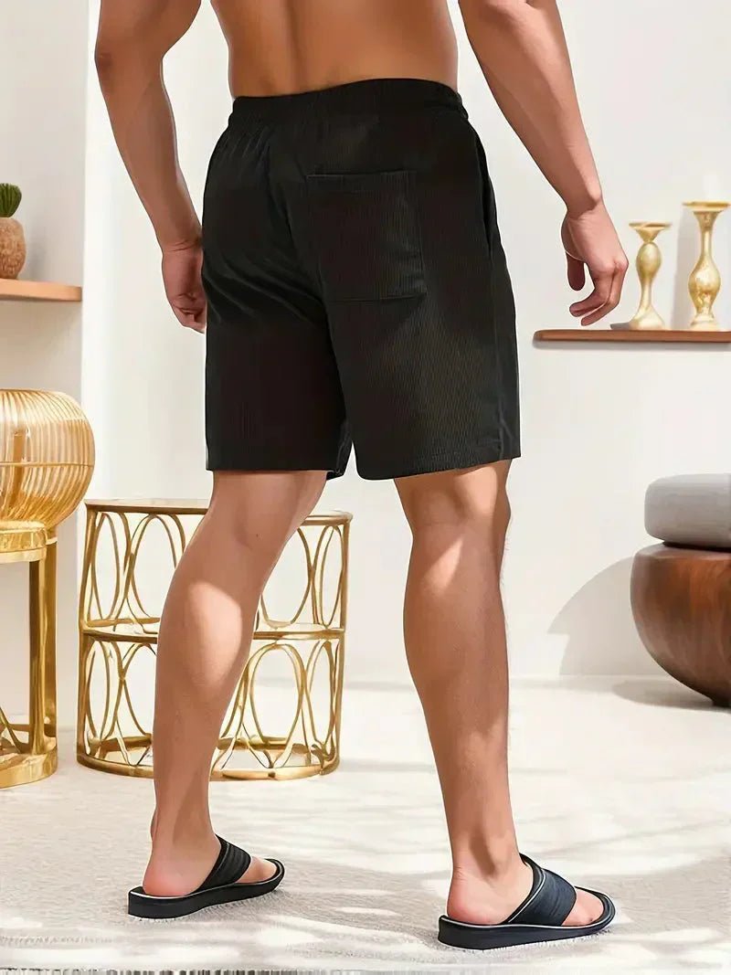 Relaxed fit men's shorts with a practical drawstring, perfect for comfortable and stylish summer wear.