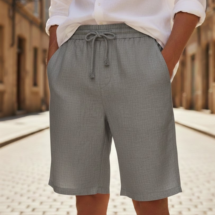 Men's relaxed fit drawstring summer shorts for casual wear. Elastic waist, knee-length for warm weather comfort.
