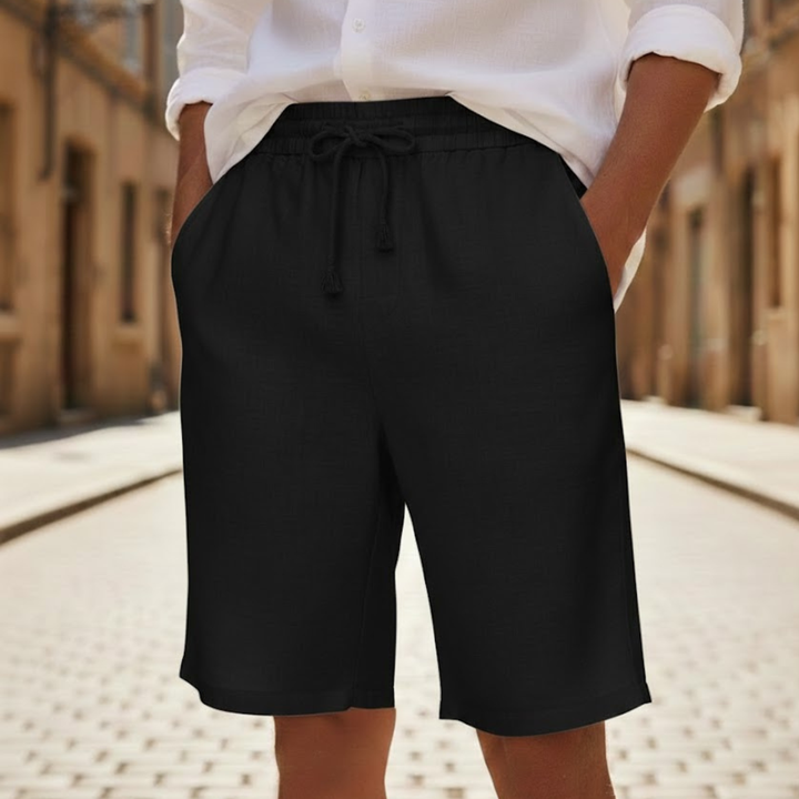 Relaxed fit men's summer shorts with elastic waist. Comfortable drawstring shorts for casual warm-weather style.