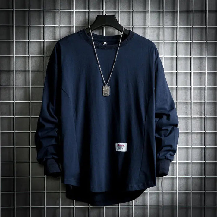 Oversized men's long sleeve crewneck pullover with a stylish drop hem, ideal layering top.