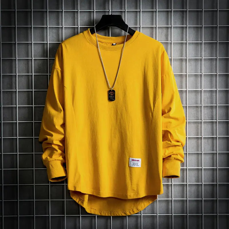 Modern men's relaxed fit drop hem pullover, a stylish long sleeve shirt for everyday comfort & layering.