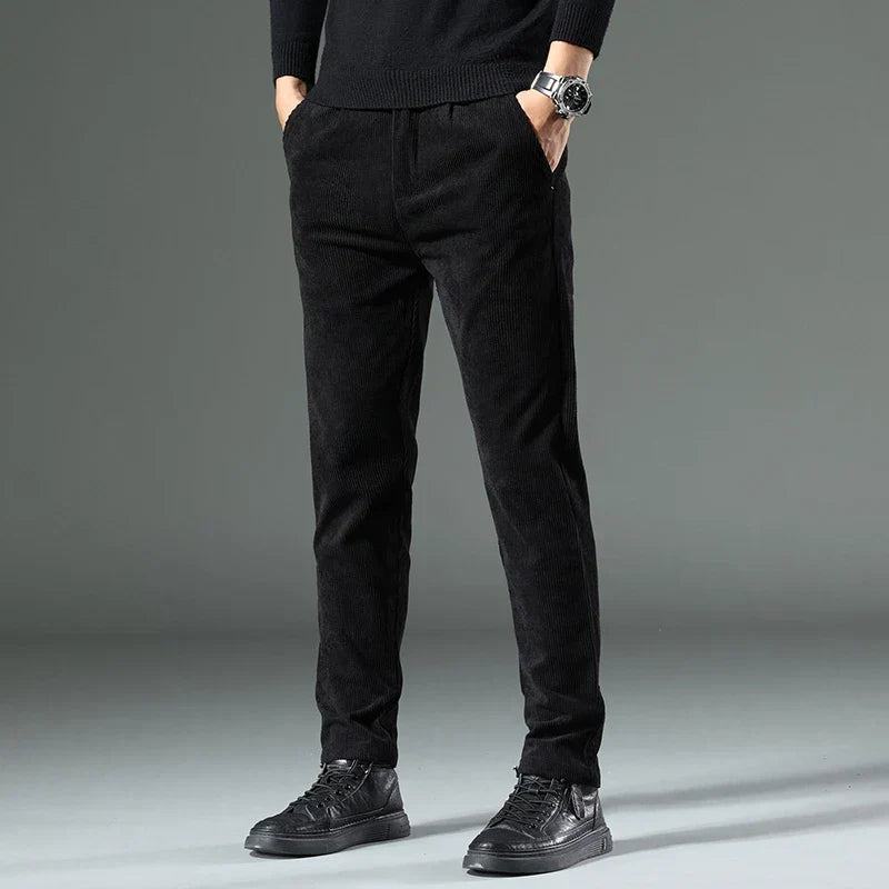 Black men's relaxed fit corduroy pants, offering classic comfort and casual style.