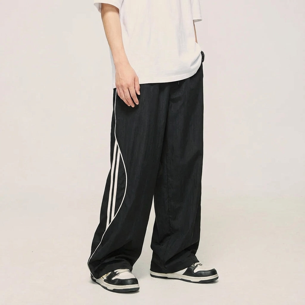 Alvin men's leisure joggers, charcoal gray with contrasting side stripes, comfortable for loungewear or sports.