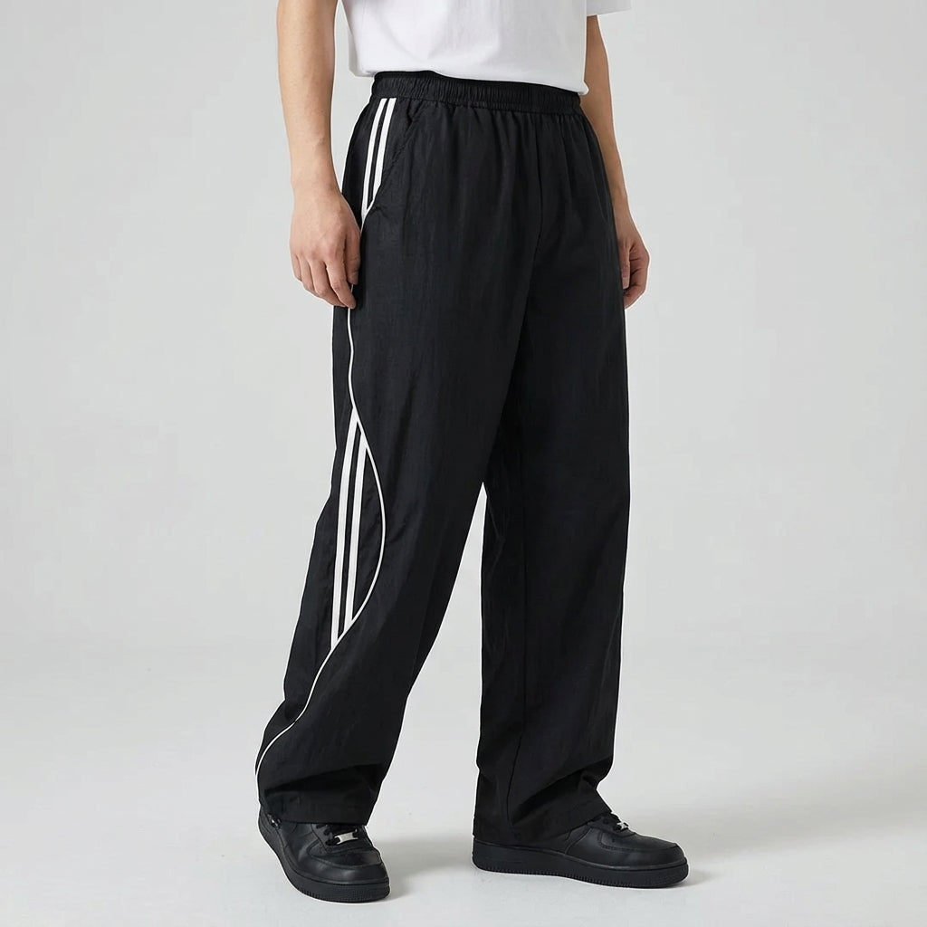 Comfortable men's joggers, activewear style with a relaxed fit and prominent side stripes, versatile casual pants.