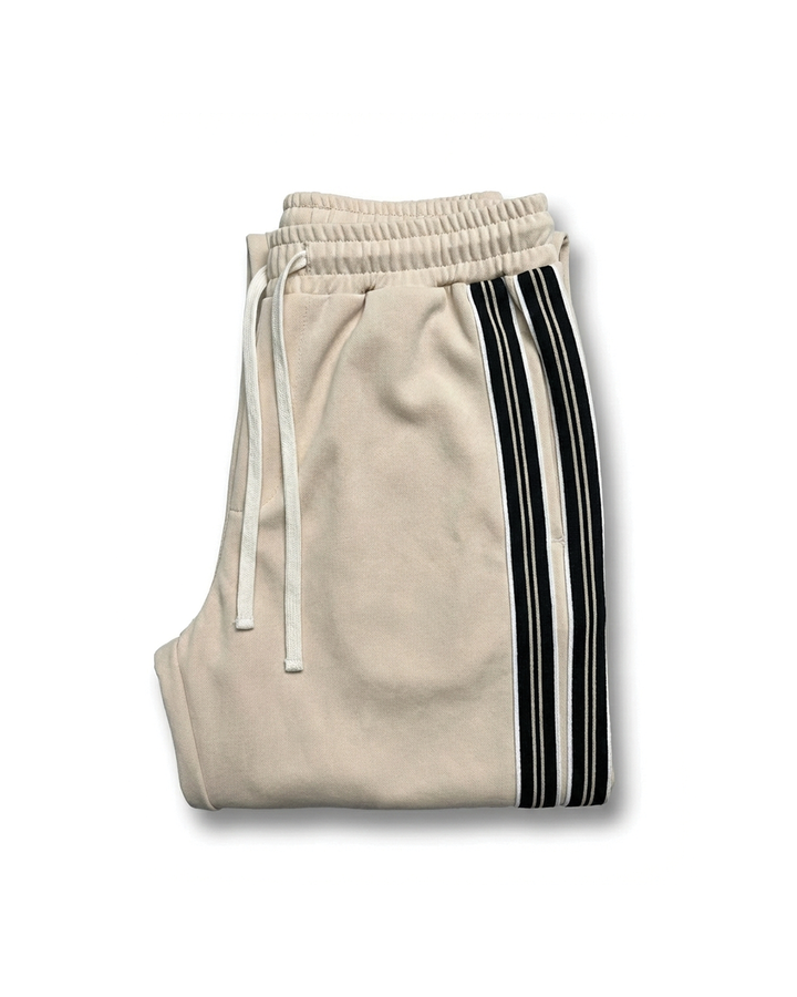 Men's relaxed fit joggers with sporty white side stripe & drawstring. Ideal for casual wear & active lifestyles.