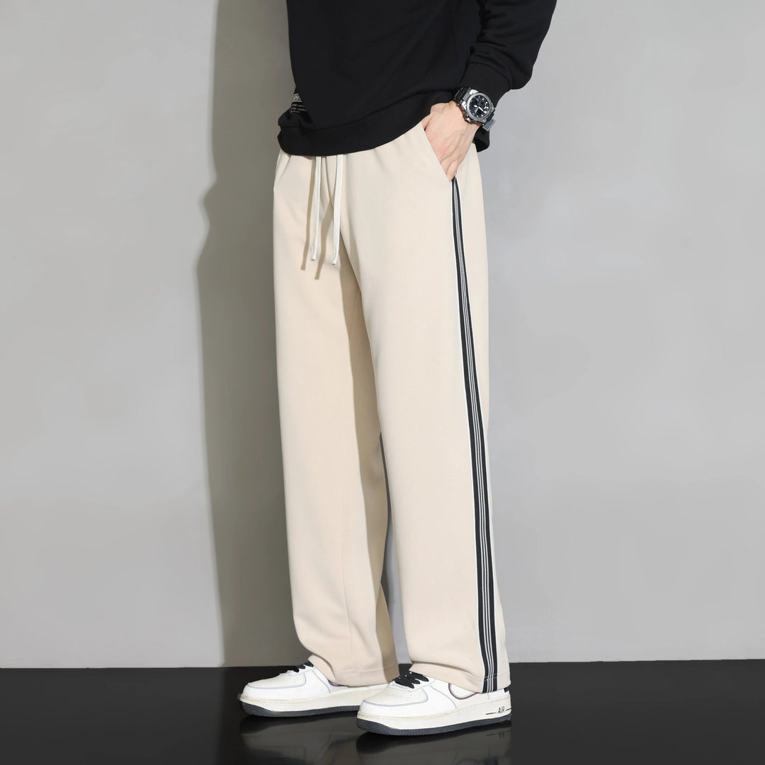 Comfortable men's polyester relaxed fit joggers. Features straight leg & athletic side stripe, perfect for lounge or sport.