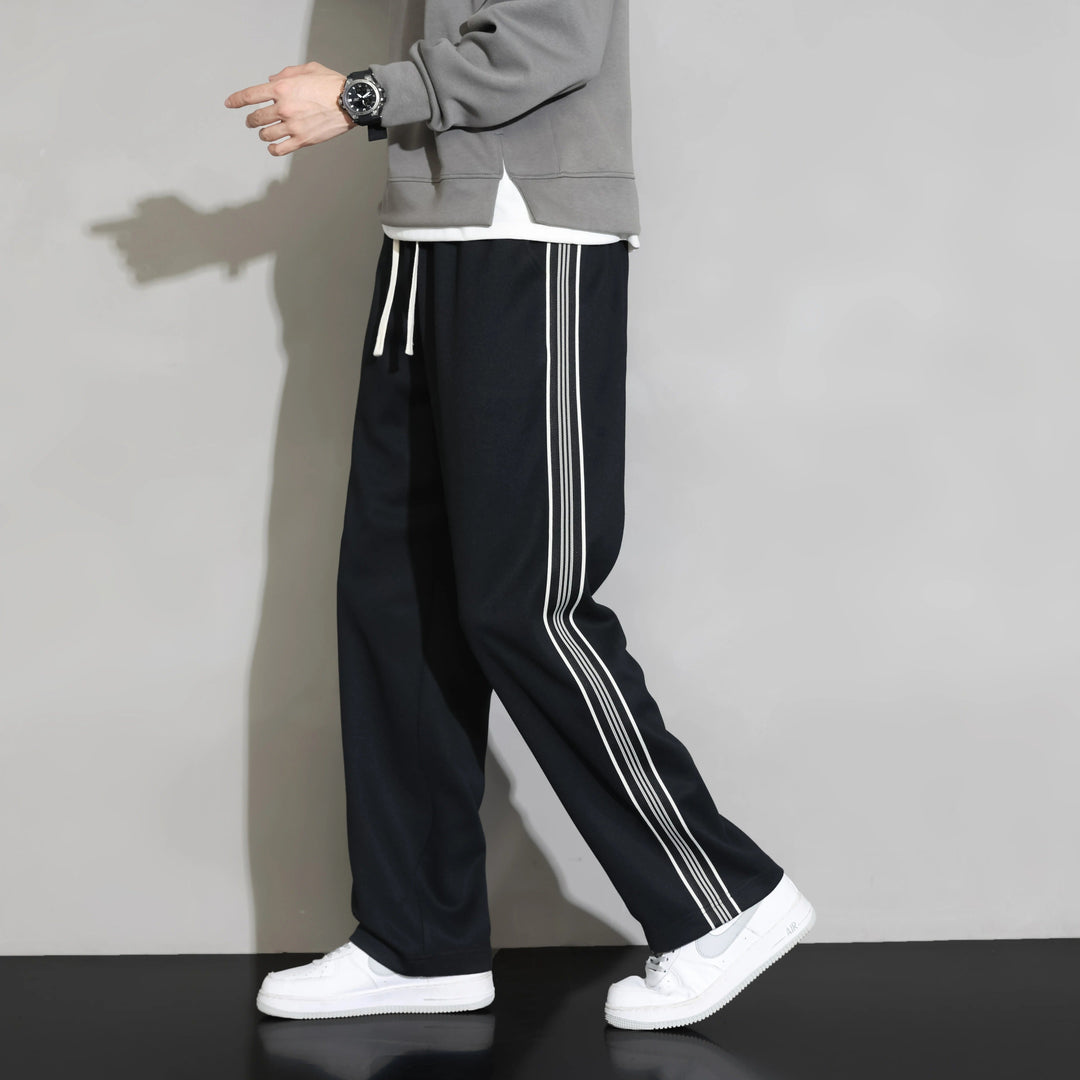 Versatile men's relaxed fit joggers, perfect for activewear or casual comfort. Black with a stylish sporty side stripe.