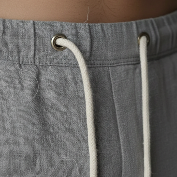 Baggy fit men's linen trousers with an adjustable drawstring waist for comfort.