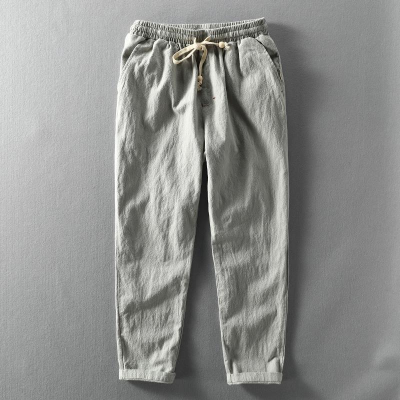 Stylish men's linen trousers with a relaxed fit, ideal for casual summer fashion. Features a practical drawstring waist.