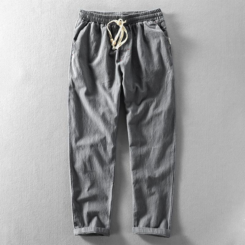 Breathable men's linen pants with a relaxed fit. Lightweight summer trousers with a drawstring, great for warm weather.