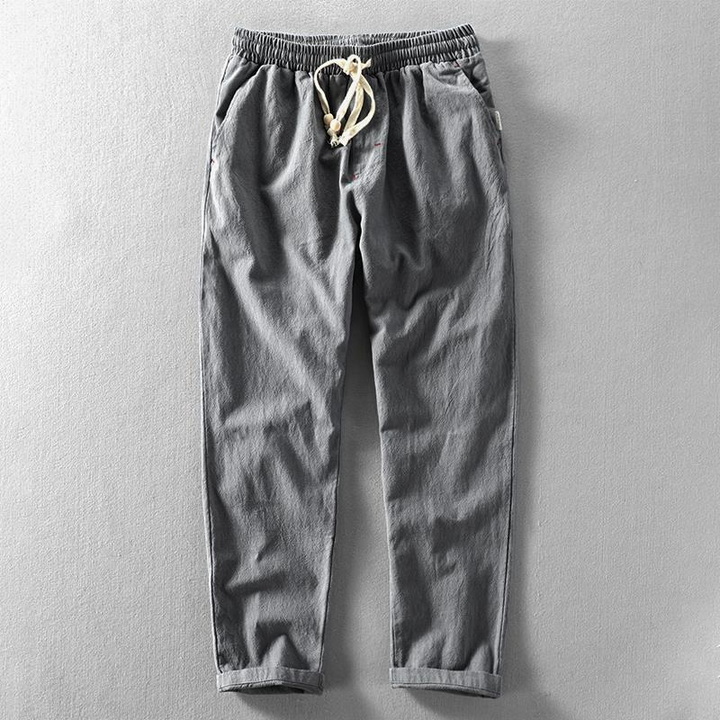 Breathable men's linen pants with a relaxed fit. Lightweight summer trousers with a drawstring, great for warm weather.