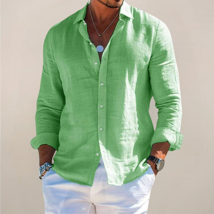 Detail shot of a men's relaxed fit button down shirt, highlighting comfortable fabric and versatile long sleeves.