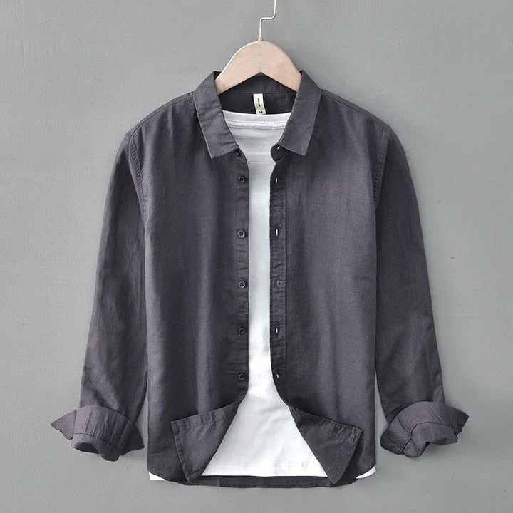 Men's relaxed fit long sleeve button-down shirt in lightweight, breathable fabric for warm weather style.