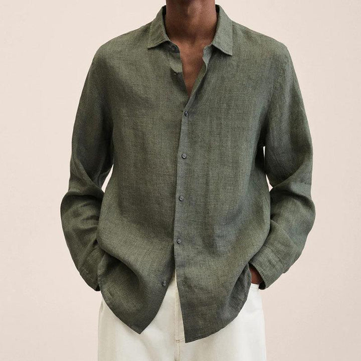 Folded men's relaxed fit long sleeve linen cotton shirt, highlighting its comfortable, airy design.