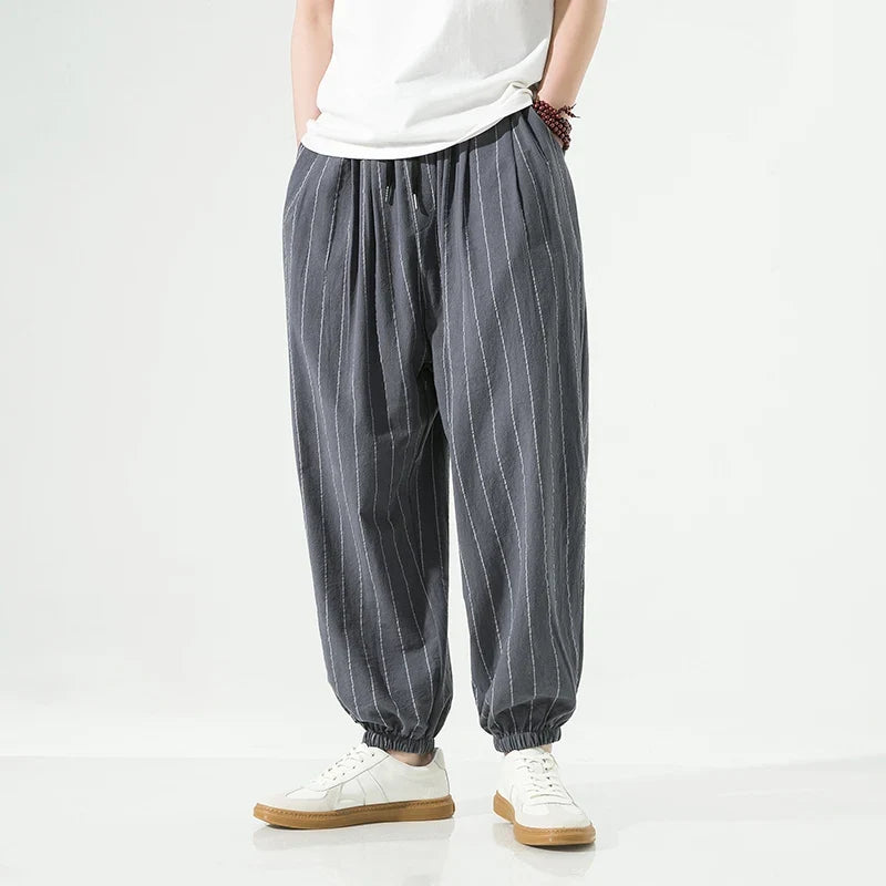 Casual men's relaxed fit joggers, soft and comfortable, featuring elastic cuffs for athleisure style.