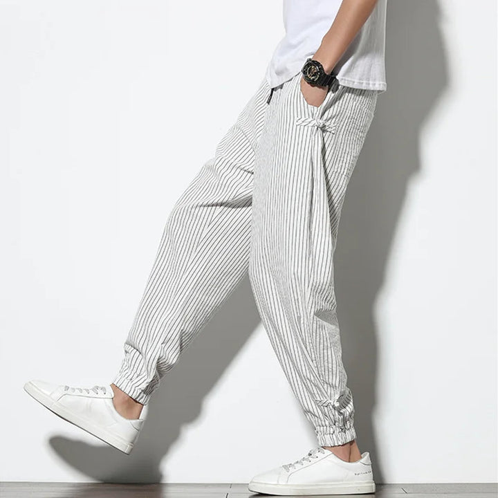 Men's relaxed fit pinstripe joggers with drawstring waist for ultimate casual comfort.