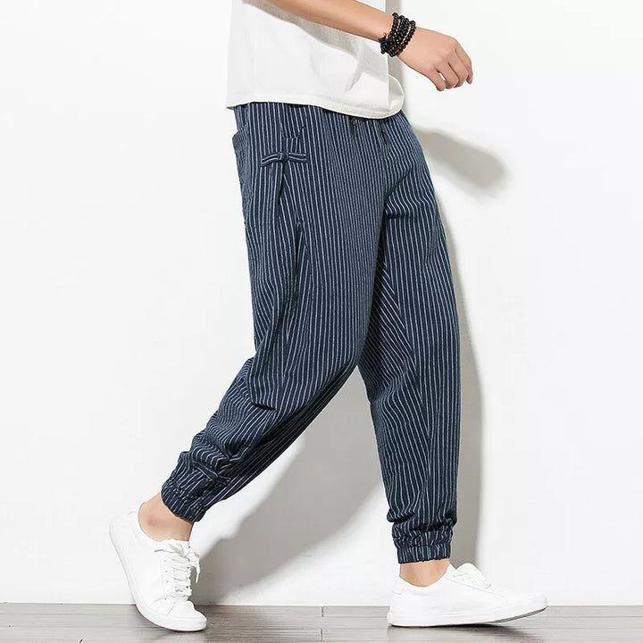 Versatile men's pinstripe casual pants, featuring a relaxed fit and comfortable drawstring waist.