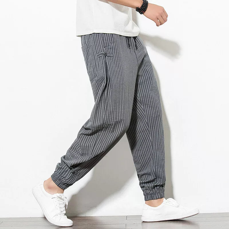 Modern men's pinstripe loungewear joggers, combining street style with ultimate comfort.