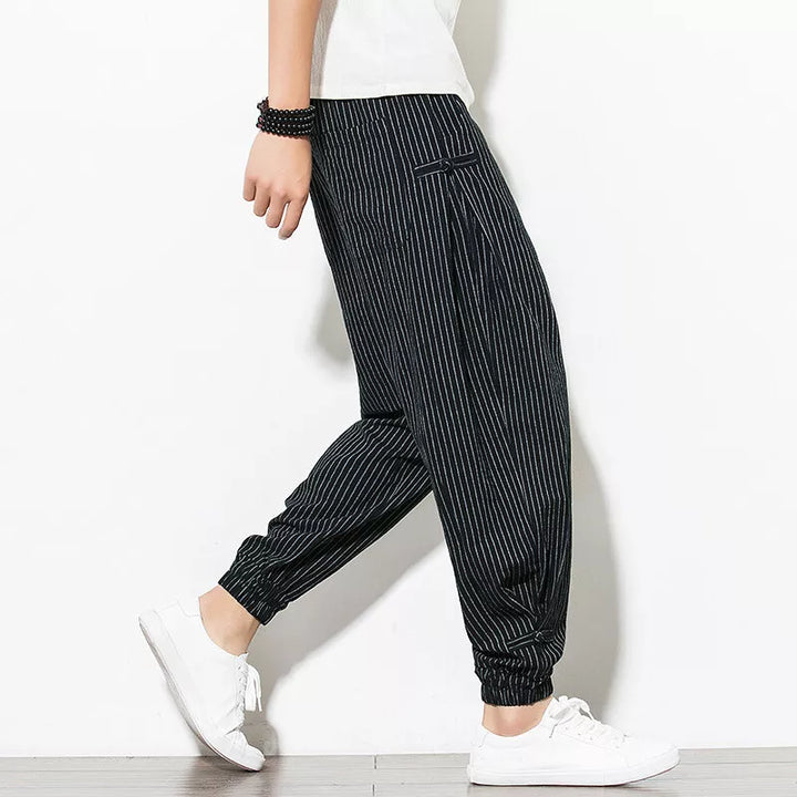 Casual men's pinstripe athletic joggers, designed for a relaxed fit and everyday versatility.
