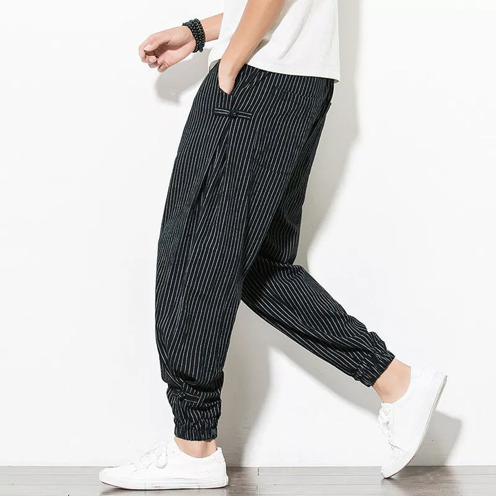 Stylish mens apparel: relaxed pinstripe joggers, perfect for comfortable lounging or street style.