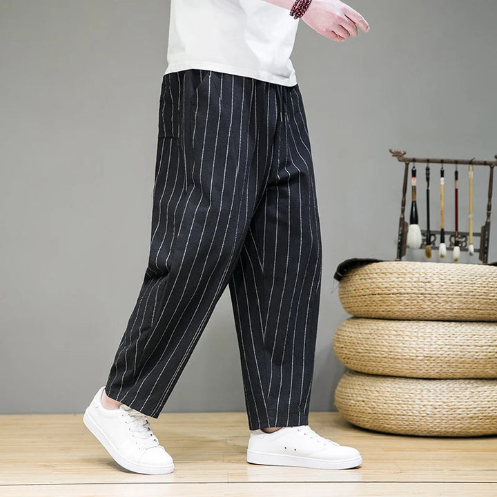 Comfortable men's pinstripe lounge pants for ultimate relaxation, featuring a relaxed fit and wide leg design.