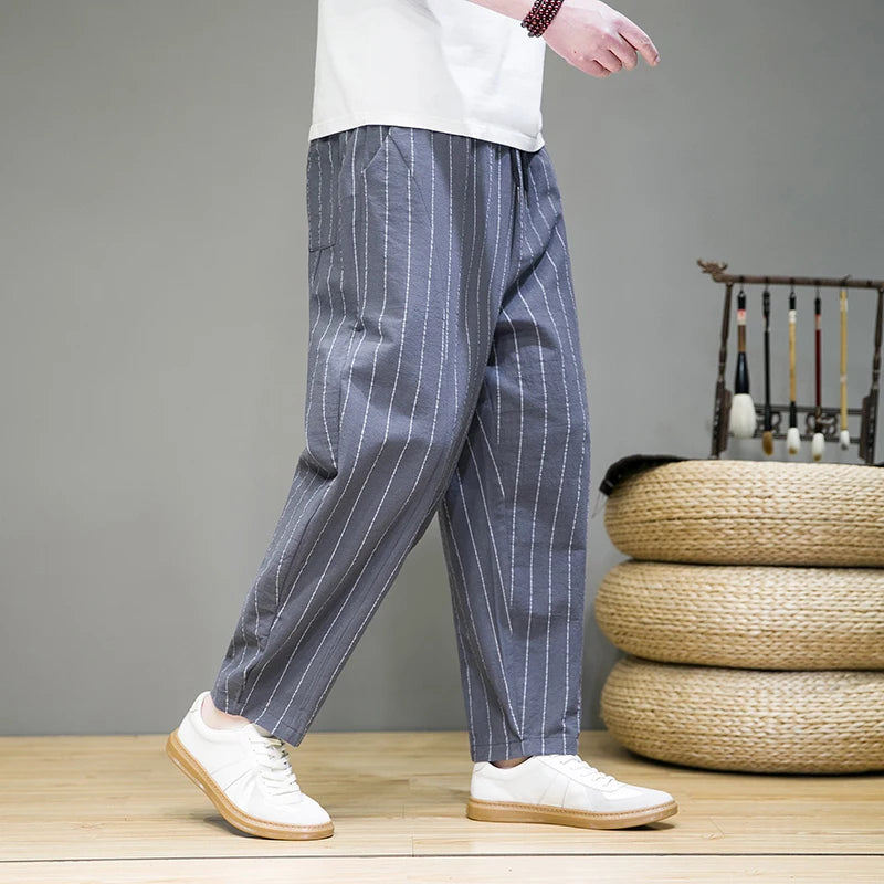 Men's casual pinstripe lounge pants with relaxed wide leg and drawstring, a comfortable and fashionable choice.