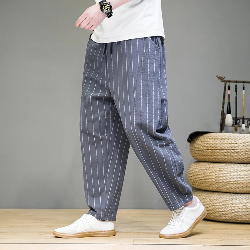 Relaxed fit men's pinstripe lounge pants with drawstring, offering comfort and style for casual & weekend wear.
