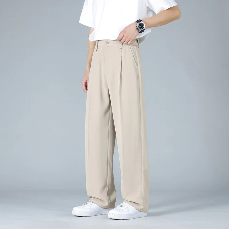 Men's relaxed fit pleated dress trousers for modern comfort & style. Business casual, versatile pants.