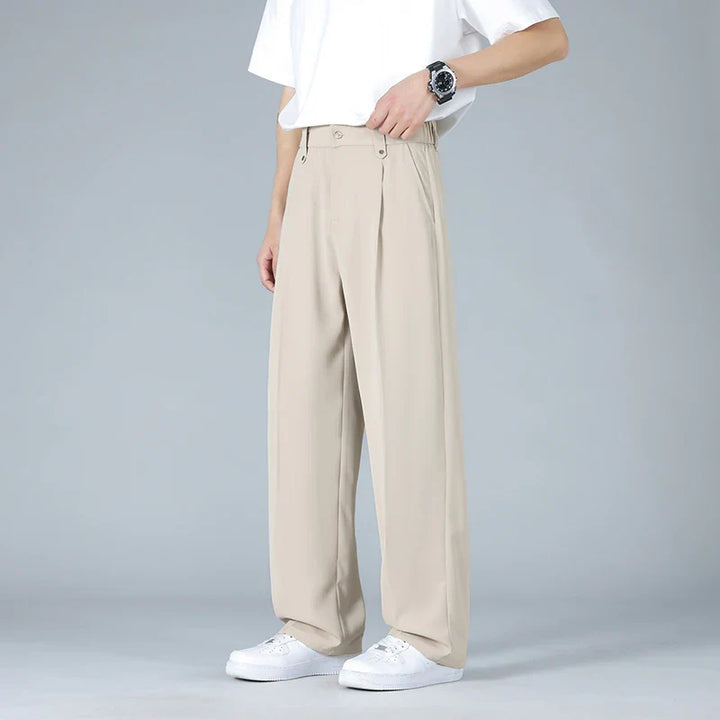 Men's relaxed fit pleated dress trousers for modern comfort & style. Business casual, versatile pants.