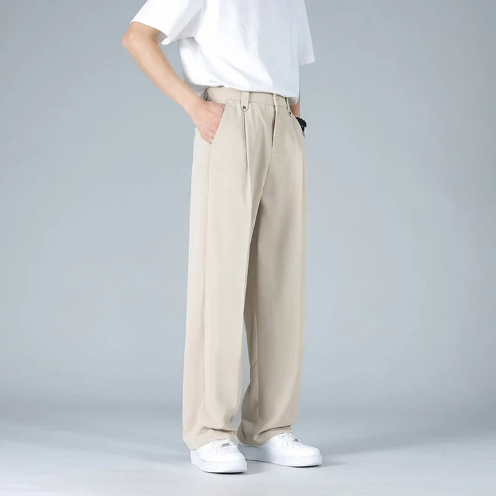Khaki men's relaxed fit pleated dress trousers, ideal for business casual, smart casual, & workday outfits.