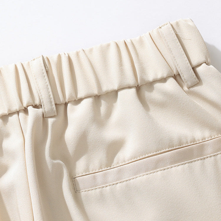 Workday-ready men's relaxed fit pleated dress trousers for comfort & professional style. Men's fashion.