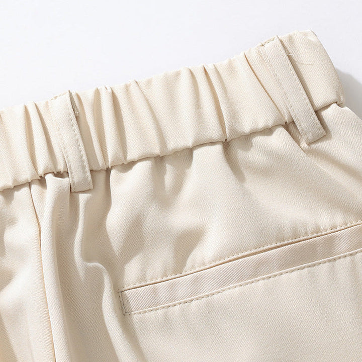 Workday-ready men's relaxed fit pleated dress trousers for comfort & professional style. Men's fashion.