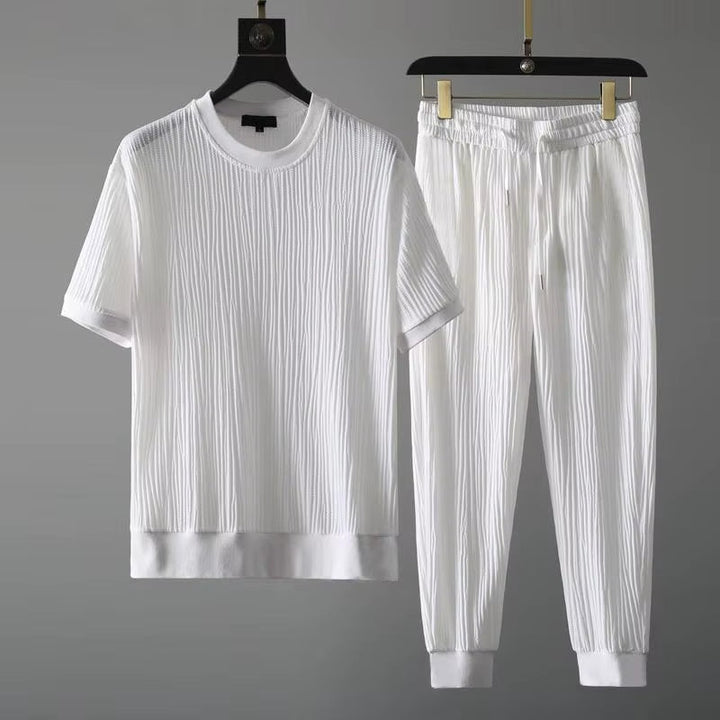 Stylish men's matching pleated loungewear set in white, ideal for a relaxed fit and casual men's fashion.