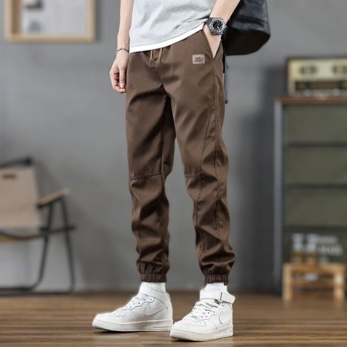 Polyester men's joggers, relaxed fit with tapered leg, perfect comfortwear for a casual yet stylish look.