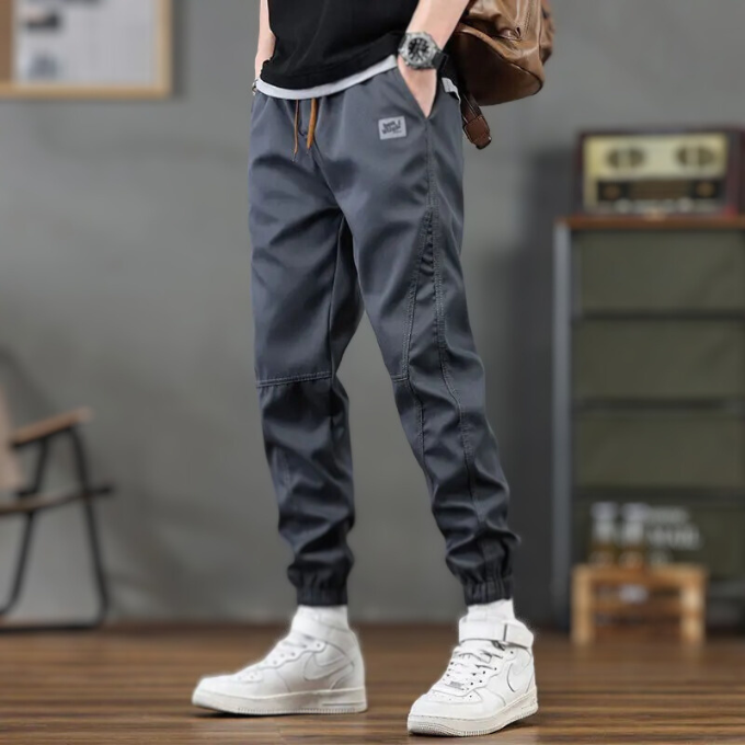 Durable polyester men's pants: relaxed fit joggers with a tapered leg & drawstring for ultimate comfortwear.