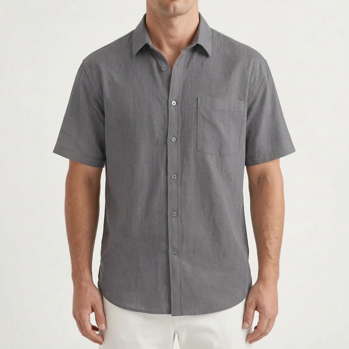 Modern men's relaxed fit short sleeve button down shirt, essential for summer comfort & style.