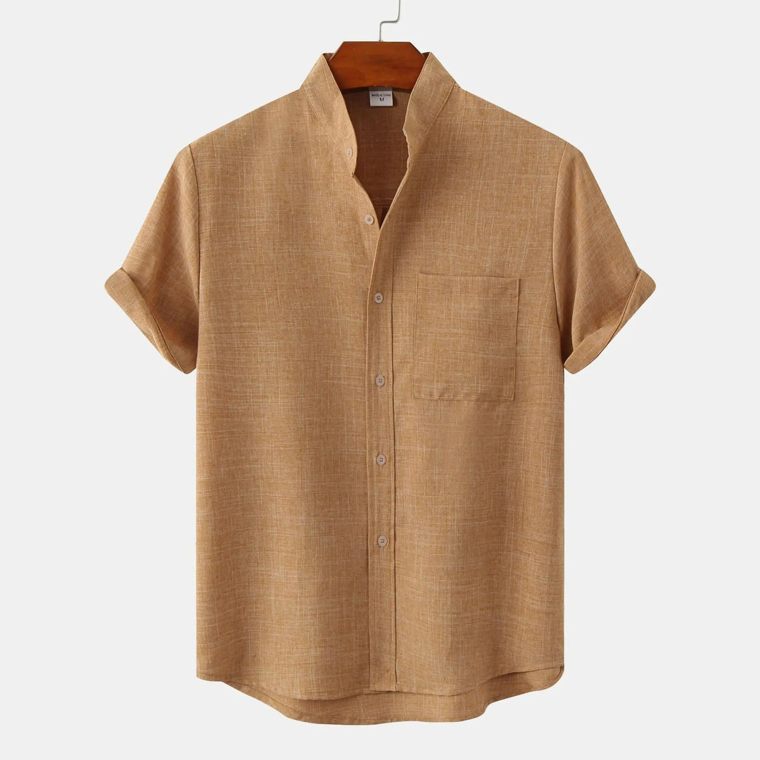 White relaxed fit short sleeve men's shirt, stand collar, ideal for warm weather comfort.