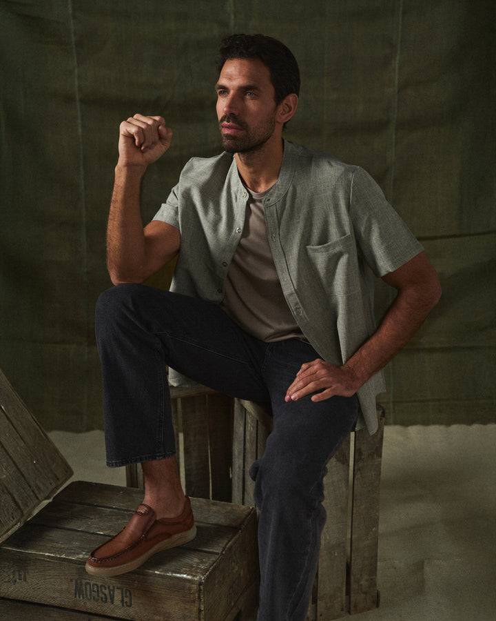 Lightweight men's relaxed fit short sleeve shirt, stand collar, warm weather essential.