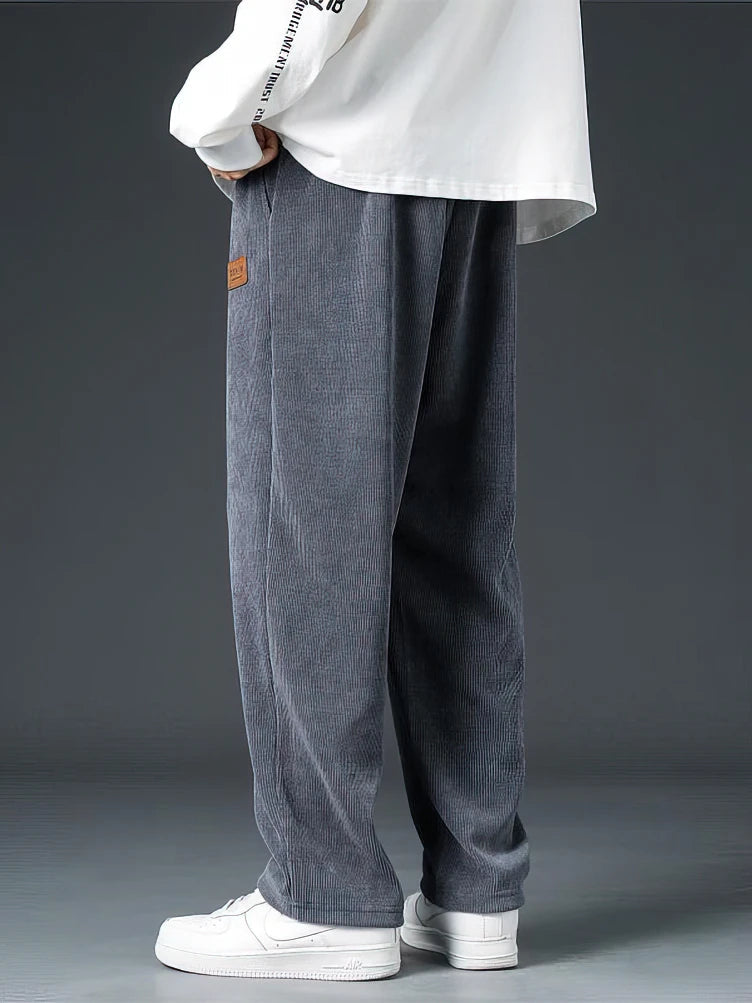 Comfortable men's relaxed straight-leg pants, ideal for casual wear, showcasing soft fabric texture and timeless design.