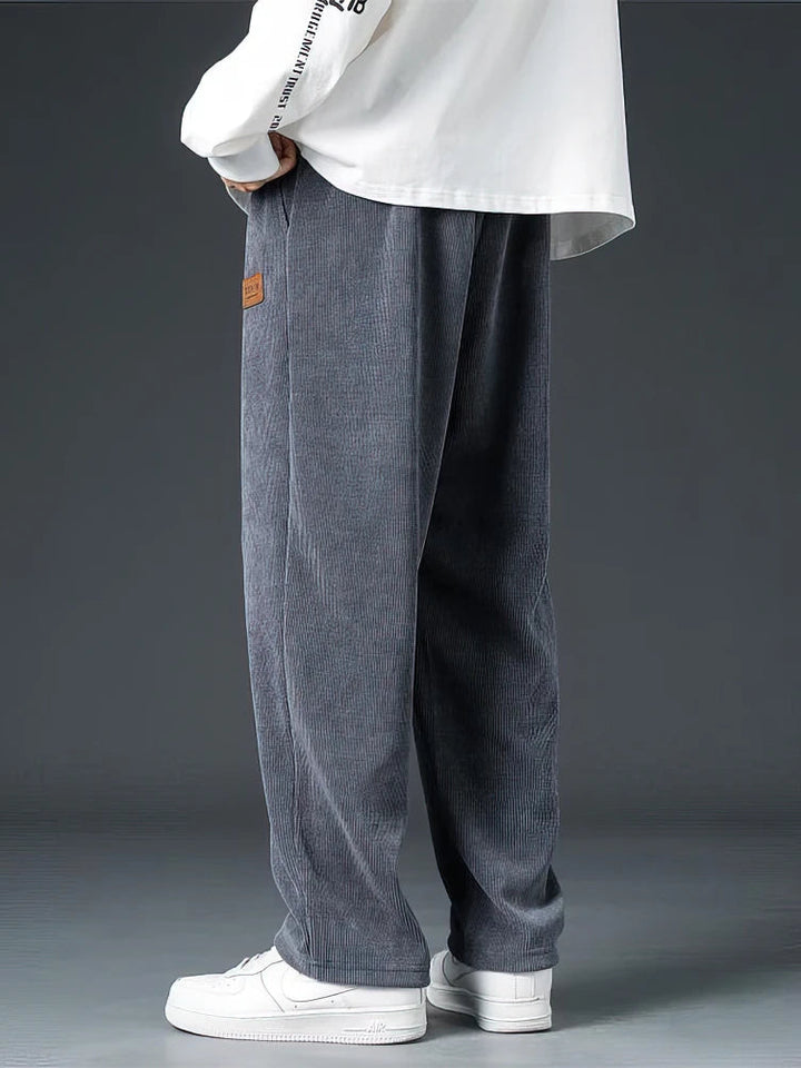 Comfortable men's relaxed straight-leg pants, ideal for casual wear, showcasing soft fabric texture and timeless design.