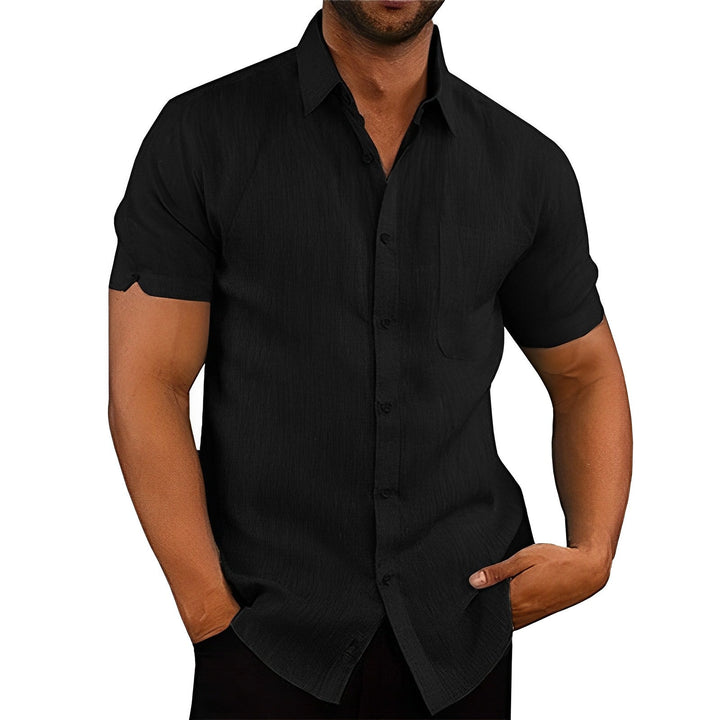 Stylish men's short sleeve button-up shirt, relaxed fit for summer comfort, versatile casual and vacation wear.