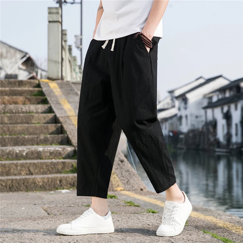 Full-length men's relaxed fit summer pants, made from breathable, comfortable fabric.
