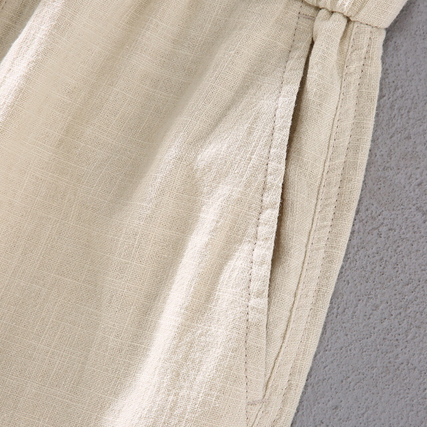 Lightweight men's shorts, mid-thigh length with drawstring, offering relaxed fit for summer comfort.