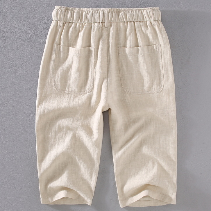Comfortable men's mid-thigh summer shorts with drawstring waist, ideal for beachwear or vacation.