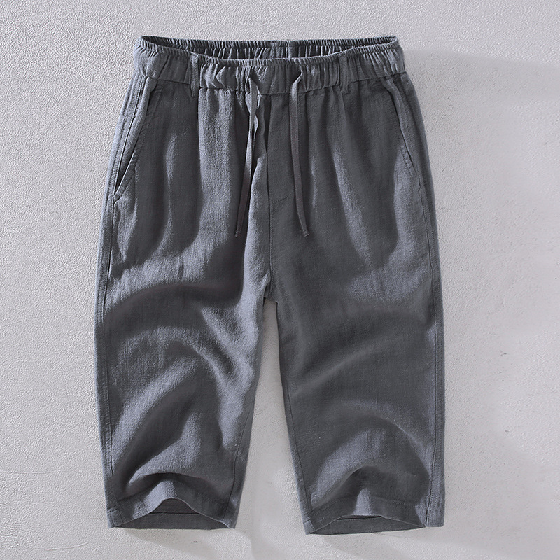 Relaxed fit men's mid-thigh shorts, perfect casual wear for summer, vacation, or beach days.