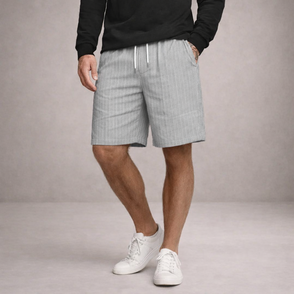 Man wearing stylish men's summer shorts, drawstring & relaxed fit, knee-length for comfortable wear.